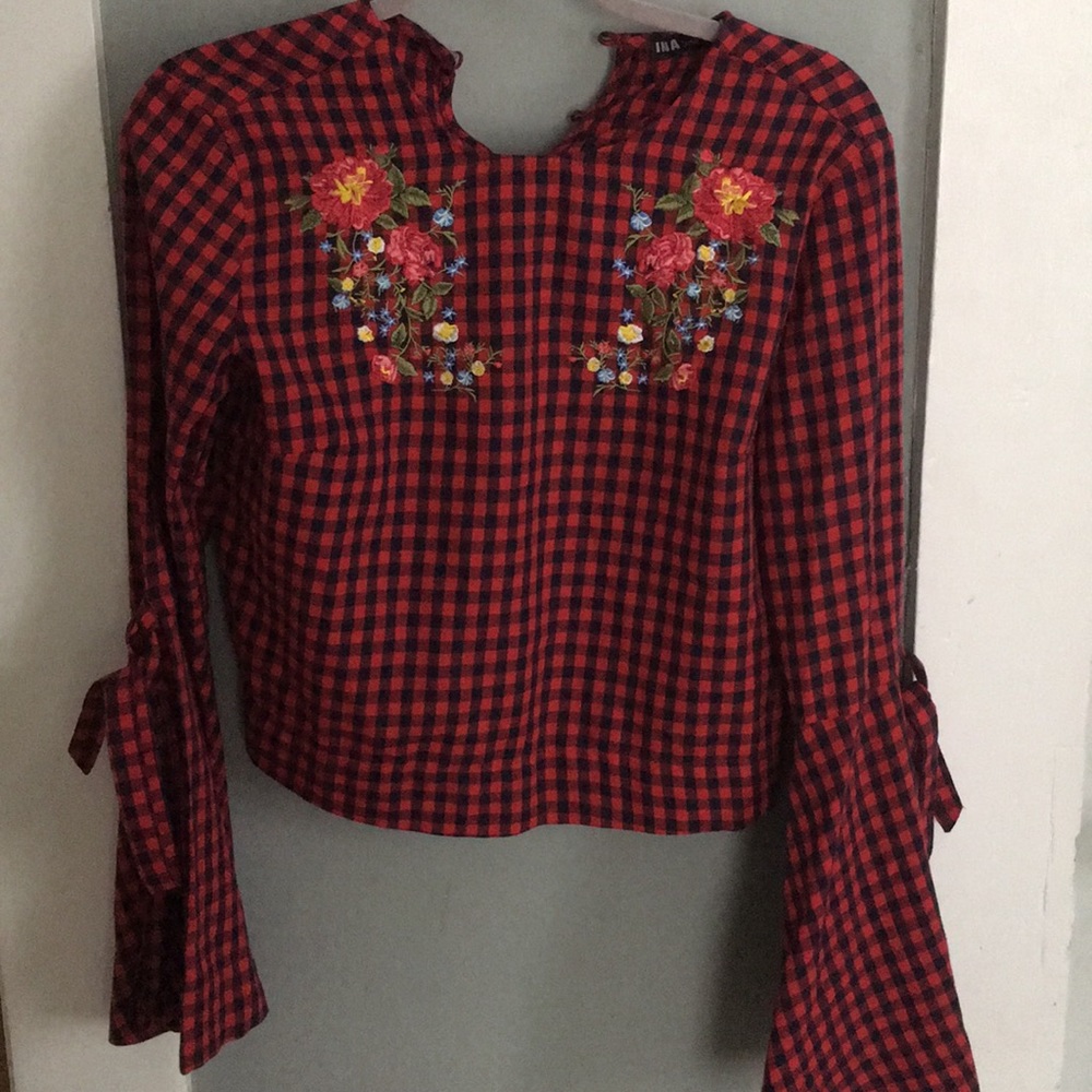 Plaid crop top with bell sleeves.